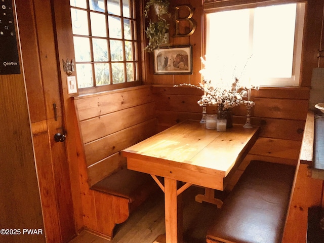 dining area with wood walls