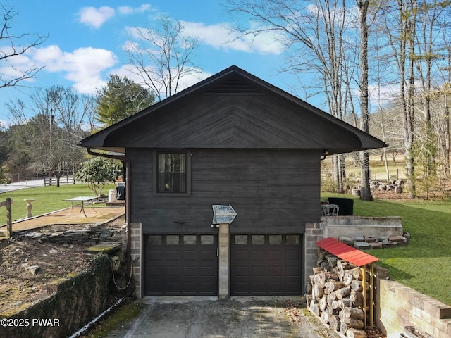 view of property exterior featuring a yard and a garage