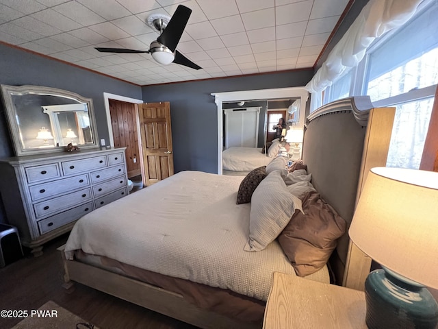 bedroom featuring wood-type flooring and ceiling fan