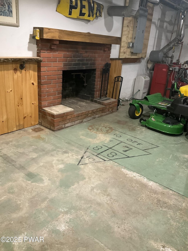 interior space with concrete floors, a fireplace, and electric panel