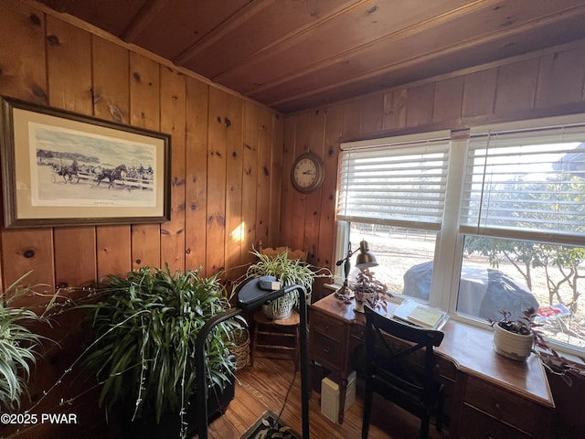 dining space featuring wooden ceiling, wooden walls, and hardwood / wood-style flooring