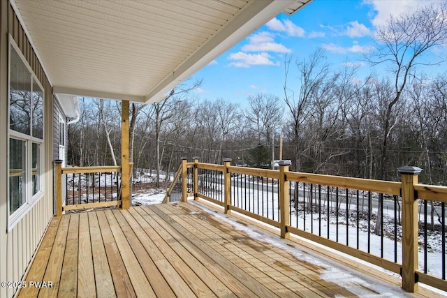 view of snow covered deck