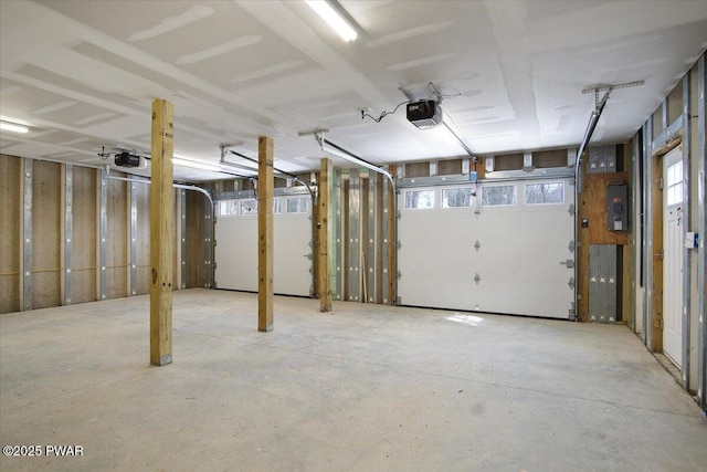 garage featuring a garage door opener and electric panel