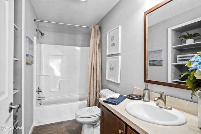 full bathroom featuring vanity, wood-type flooring, toilet, and shower / bath combo