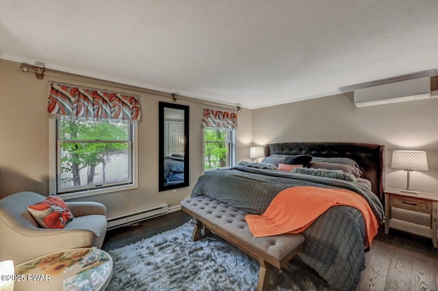 bedroom with wood finished floors, crown molding, and baseboard heating