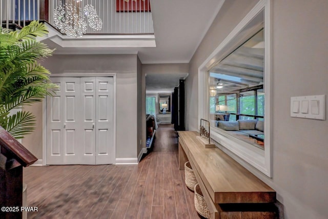 foyer with wood finished floors and baseboards