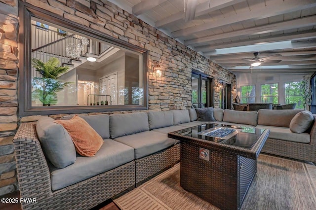 living room featuring beamed ceiling, wood ceiling, a ceiling fan, and wood finished floors