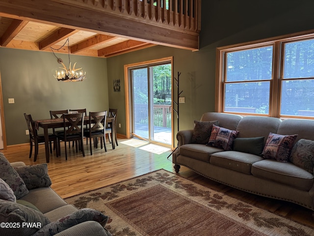 278 N Gate Rd, Lake Ariel, PA 18436 - living room featuring a chandelier, wood finished floors, and beamed ceiling