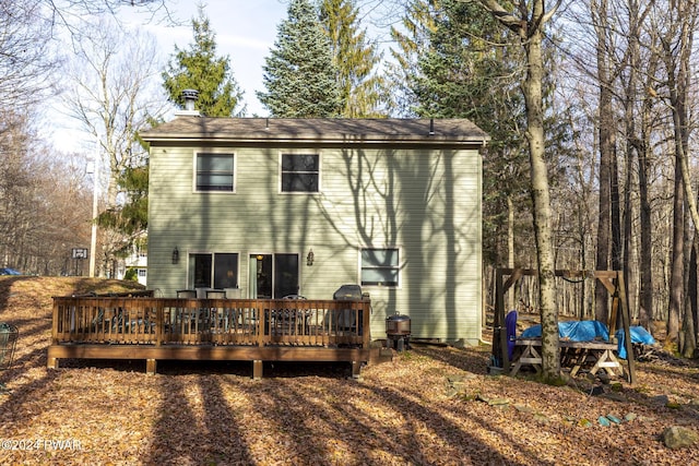 rear view of property with a deck