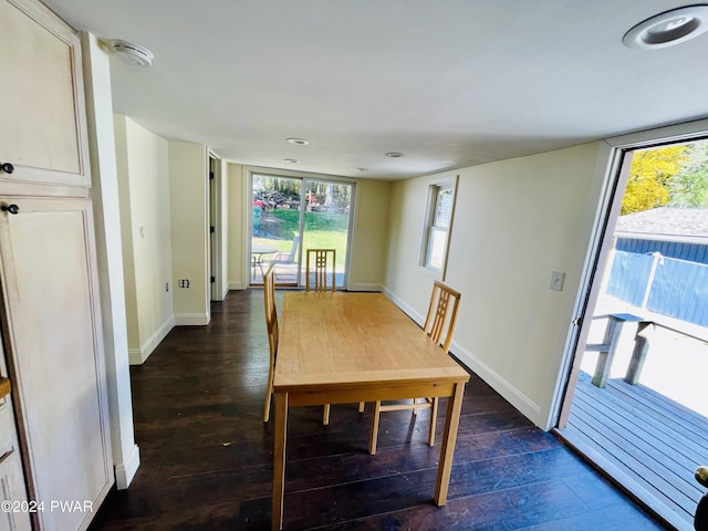 unfurnished dining area with dark hardwood / wood-style floors and plenty of natural light