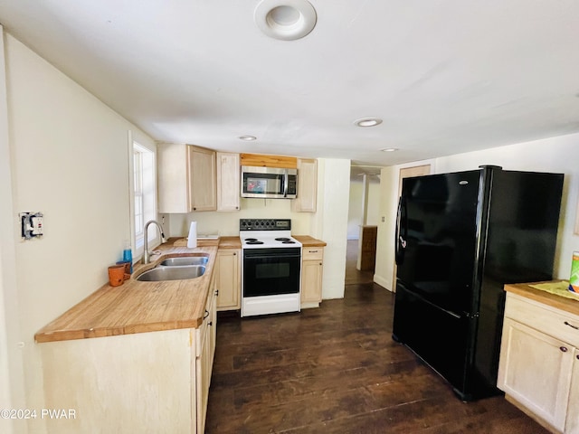 kitchen with black refrigerator, wooden counters, dark hardwood / wood-style flooring, white range with electric stovetop, and sink