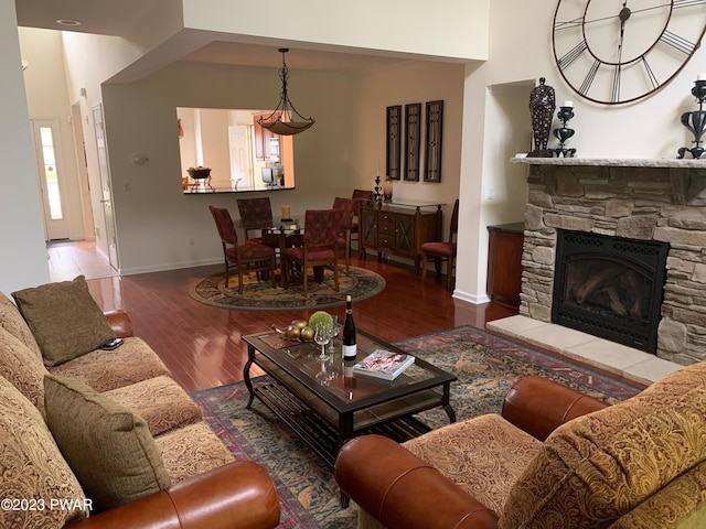 living room featuring a fireplace and hardwood / wood-style flooring