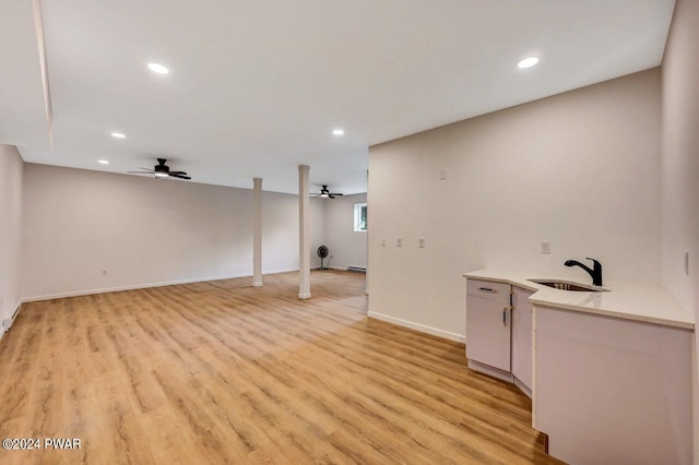 interior space featuring light wood-type flooring and sink