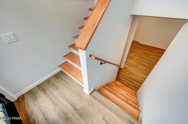 staircase featuring hardwood / wood-style floors