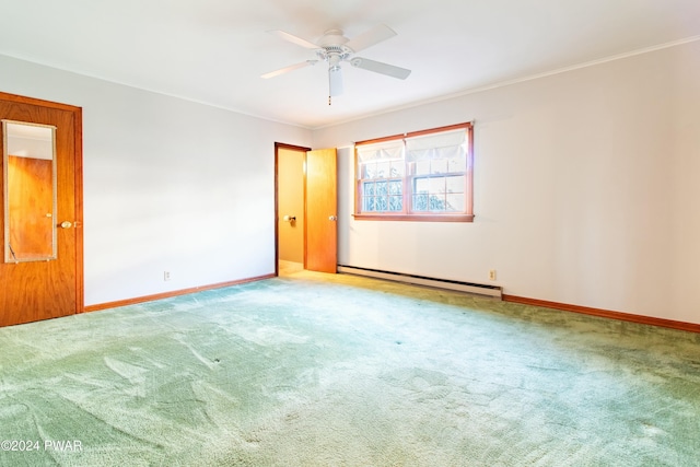 empty room featuring carpet, a baseboard radiator, ceiling fan, and ornamental molding