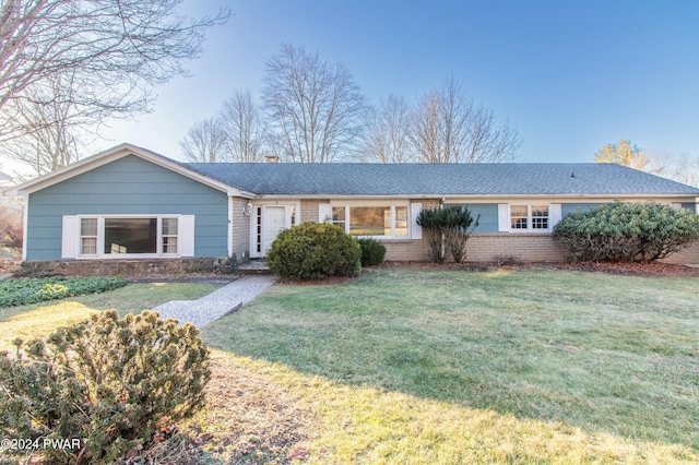 ranch-style house with a front yard