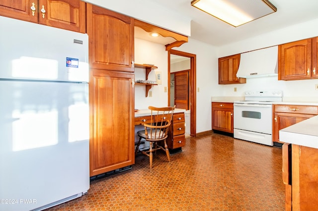 kitchen featuring white appliances and ventilation hood