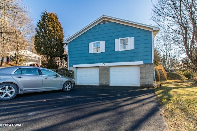 view of side of property with a garage