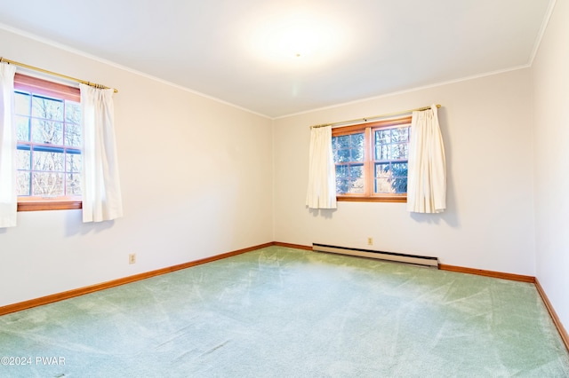 empty room featuring carpet flooring, ornamental molding, and a baseboard radiator