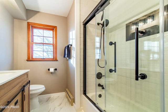 full bathroom featuring vanity, toilet, baseboard heating, and bath / shower combo with glass door