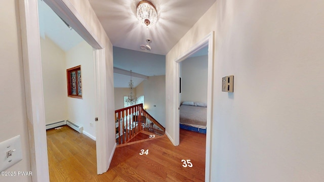 109 Lake Dr, Dingmans Ferry, PA 18328 - hall featuring an upstairs landing, a chandelier, and wood finished floors