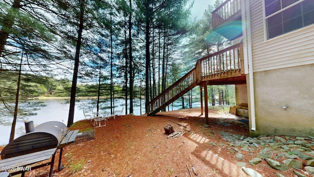 109 Lake Dr, Dingmans Ferry, PA 18328 - view of yard with stairs and a deck with water view