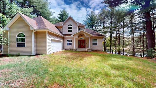 109 Lake Dr, Dingmans Ferry, PA 18328 - view of front of home with a shingled roof, a front lawn, and a garage