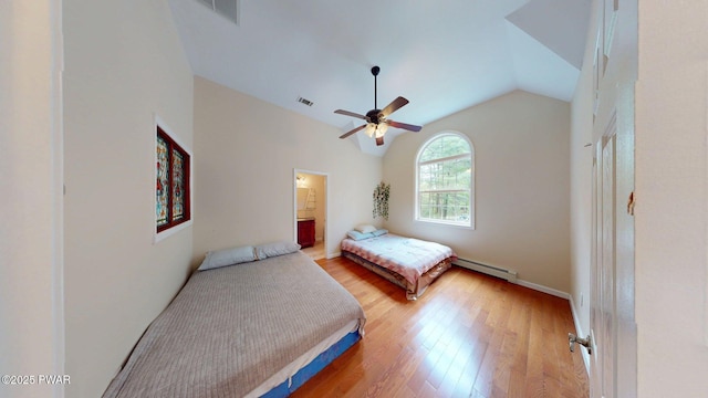 109 Lake Dr, Dingmans Ferry, PA 18328 - bedroom with vaulted ceiling, light wood-type flooring, baseboard heating, ceiling fan, and ensuite bathroom