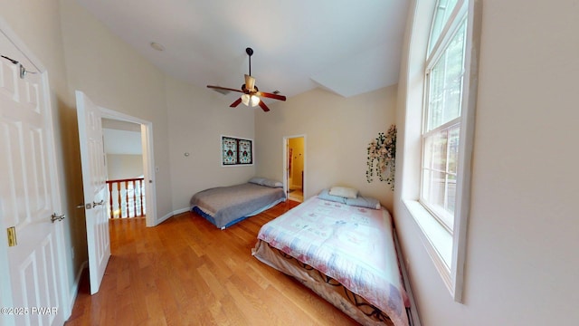 109 Lake Dr, Dingmans Ferry, PA 18328 - bedroom featuring light wood finished floors, high vaulted ceiling, and ceiling fan