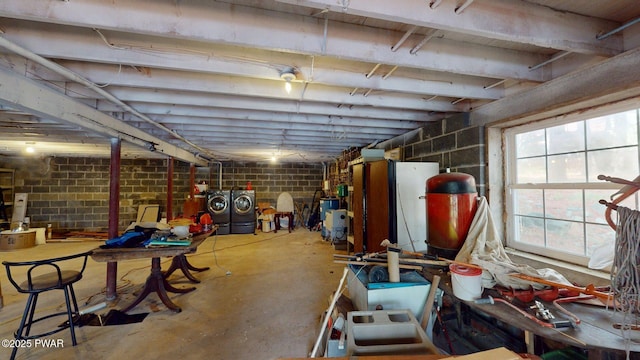 109 Lake Dr, Dingmans Ferry, PA 18328 - below grade area featuring washer and dryer, a water pressure tank, and concrete block wall