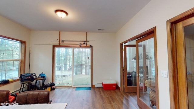 109 Lake Dr, Dingmans Ferry, PA 18328 - entryway with wood finished floors, french doors, and baseboard heating