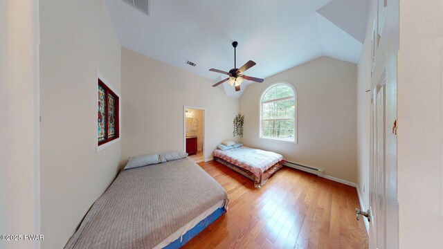 109 Lake Dr, Dingmans Ferry, PA 18328 - bedroom with vaulted ceiling, light wood-type flooring, baseboard heating, ceiling fan, and ensuite bathroom