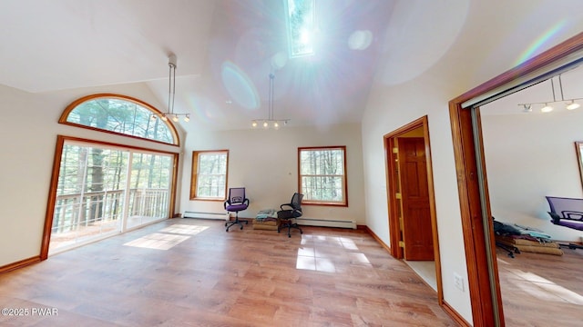 109 Lake Dr, Dingmans Ferry, PA 18328 - entryway featuring light wood-style flooring, high vaulted ceiling, and a baseboard radiator
