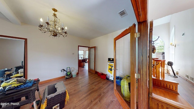 109 Lake Dr, Dingmans Ferry, PA 18328 - corridor featuring wood finished floors, a chandelier, and french doors