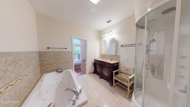 109 Lake Dr, Dingmans Ferry, PA 18328 - bathroom with a stall shower, vanity, a tub with jets, tile patterned floors, and tile walls