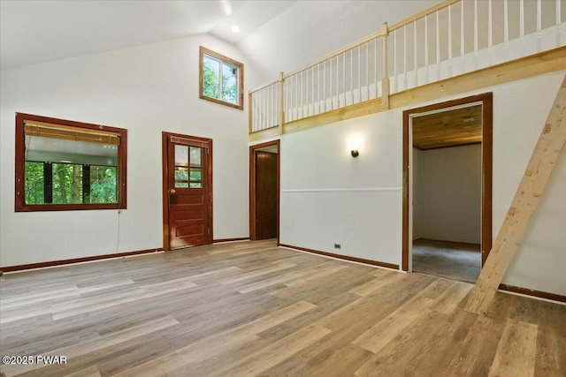 36 Rolling Acres Rd, Lake Ariel, PA 18436 - unfurnished living room with high vaulted ceiling and wood finished floors
