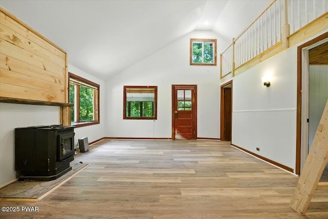 36 Rolling Acres Rd, Lake Ariel, PA 18436 - entryway with a wood stove, high vaulted ceiling, and light wood-style floors