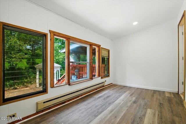 36 Rolling Acres Rd, Lake Ariel, PA 18436 - spare room featuring baseboard heating, wood finished floors, and recessed lighting