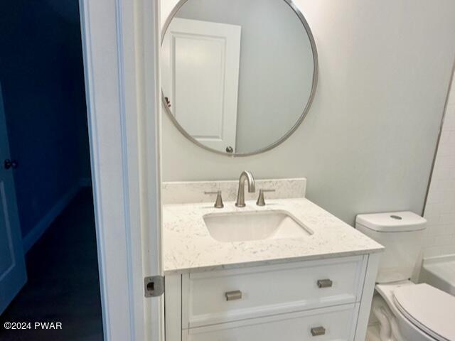 bathroom with vanity and toilet