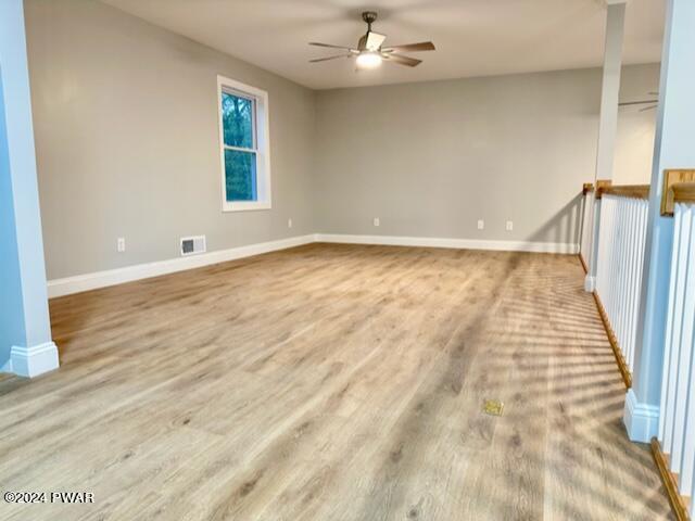 unfurnished room with ceiling fan