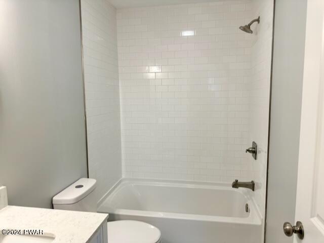 full bathroom with shower / bathing tub combination, vanity, and toilet