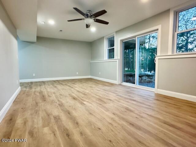 unfurnished room featuring light hardwood / wood-style flooring and ceiling fan