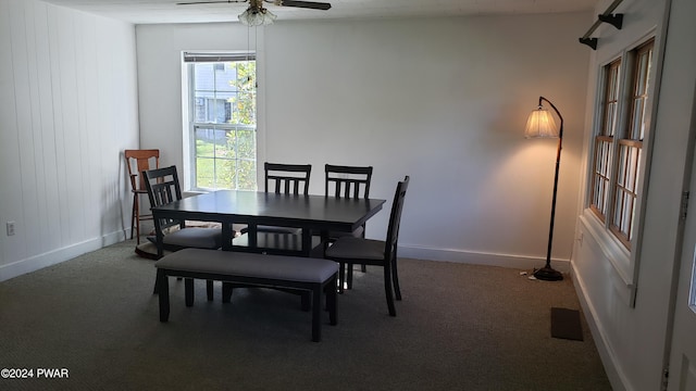 dining area featuring carpet flooring and ceiling fan