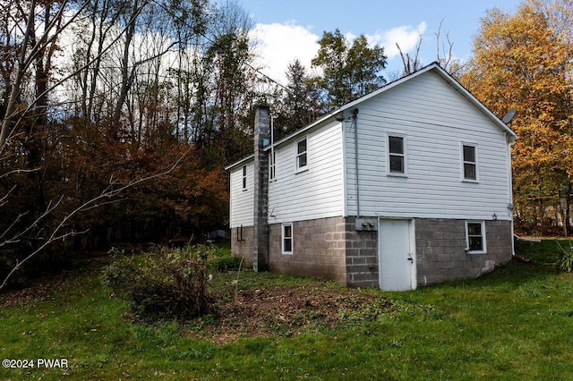 view of home's exterior featuring a lawn