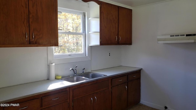 kitchen with plenty of natural light, extractor fan, and sink