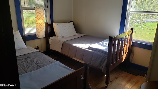 bedroom with hardwood / wood-style flooring