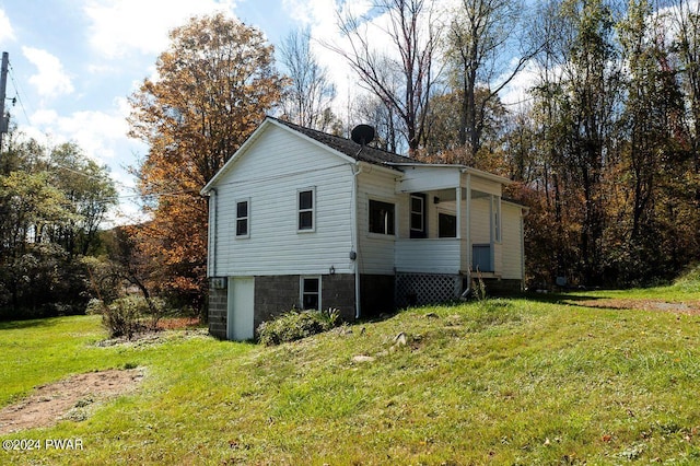 view of property exterior featuring a yard