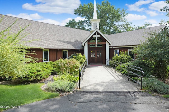 111 Blueridge Ln, Lords Valley, PA 18428 - view of front facade featuring french doors, board and batten siding, and roof with shingles