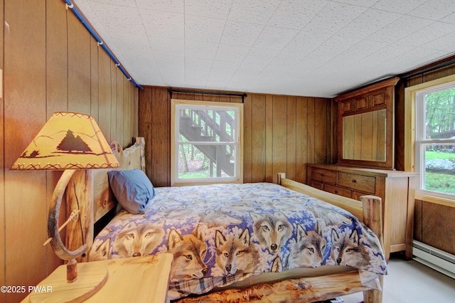 111 Blueridge Ln, Lords Valley, PA 18428 - bedroom featuring baseboard heating and wooden walls