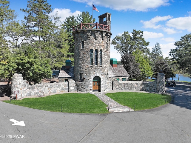 111 Blueridge Ln, Lords Valley, PA 18428 - view of front facade with stone siding and a front lawn